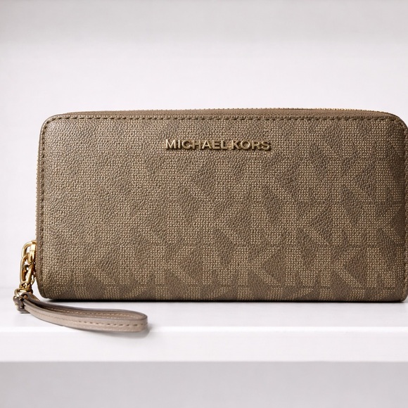 Michael Kors Handbags - Michael Kors Tan Wristlet Clutch GUC